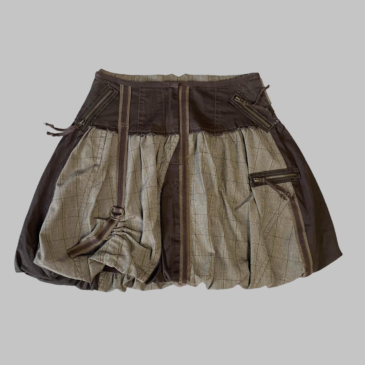 Multi-material brown bubble skirt.