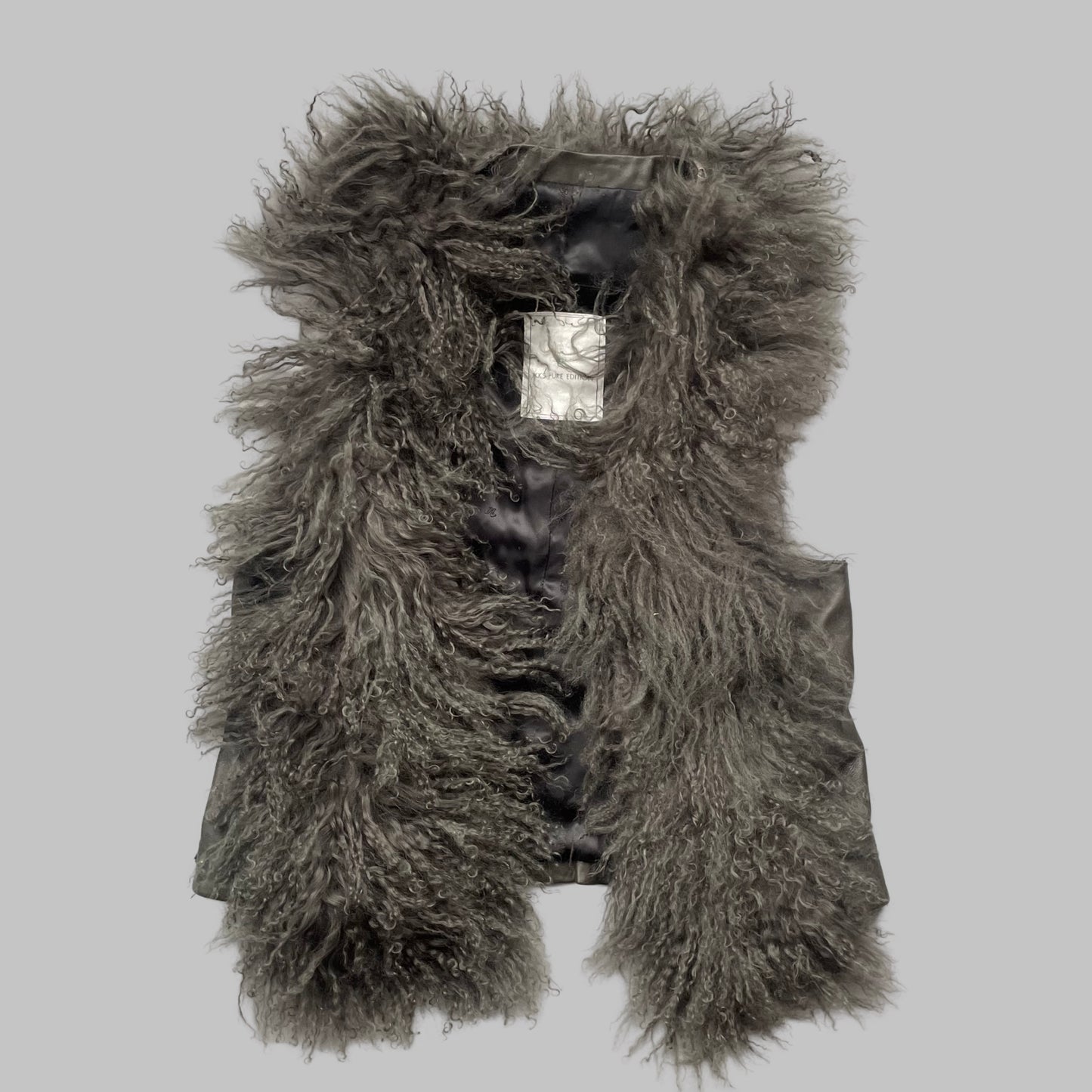 Mongolian fur sleeveless leather vest.