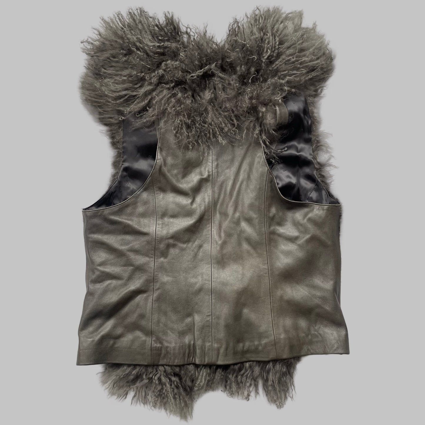 Mongolian fur sleeveless leather vest.