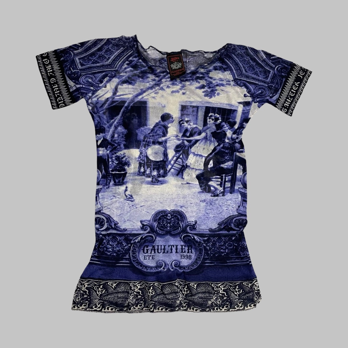 Jean Paul Gaultier blue mesh top.