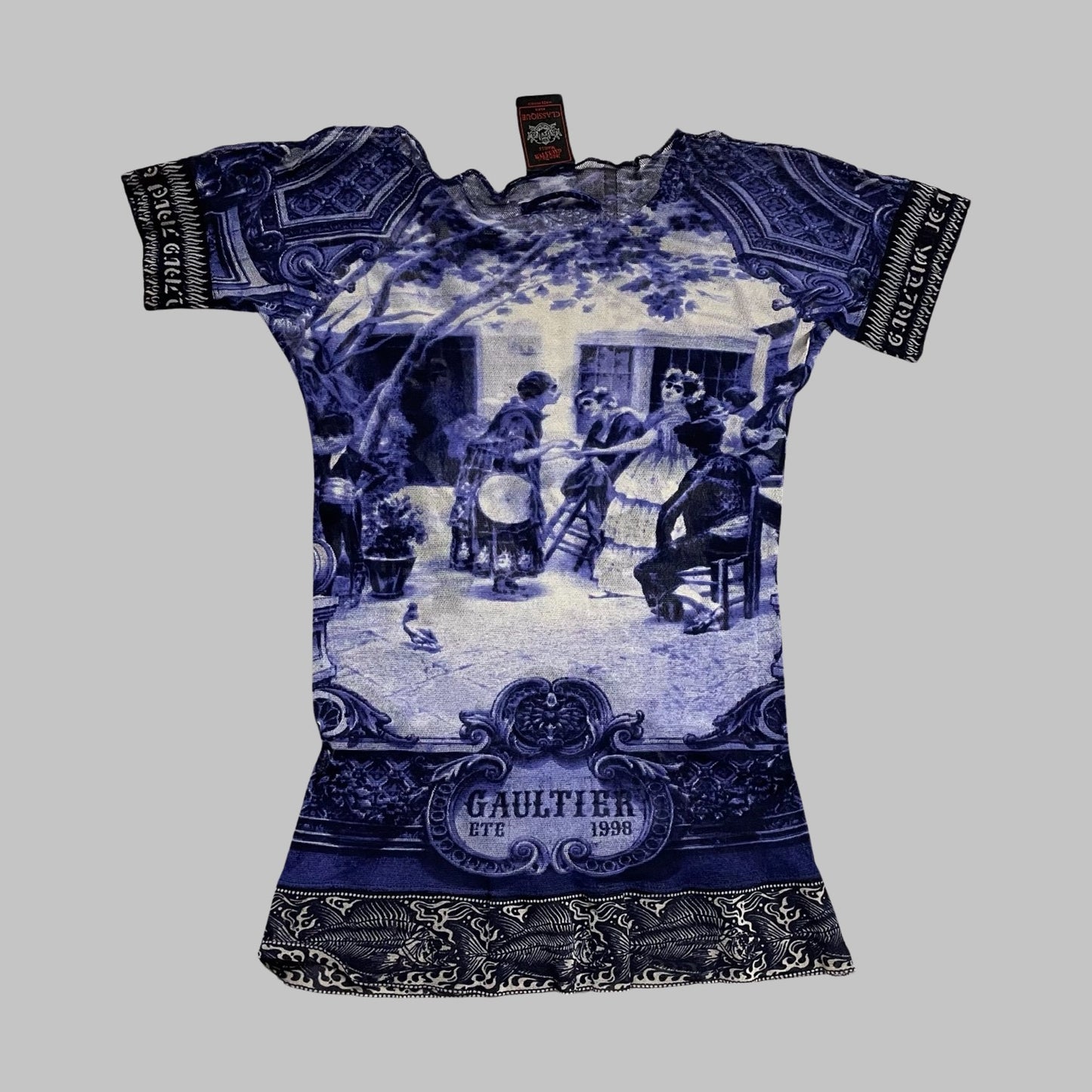 Jean Paul Gaultier blue mesh top.