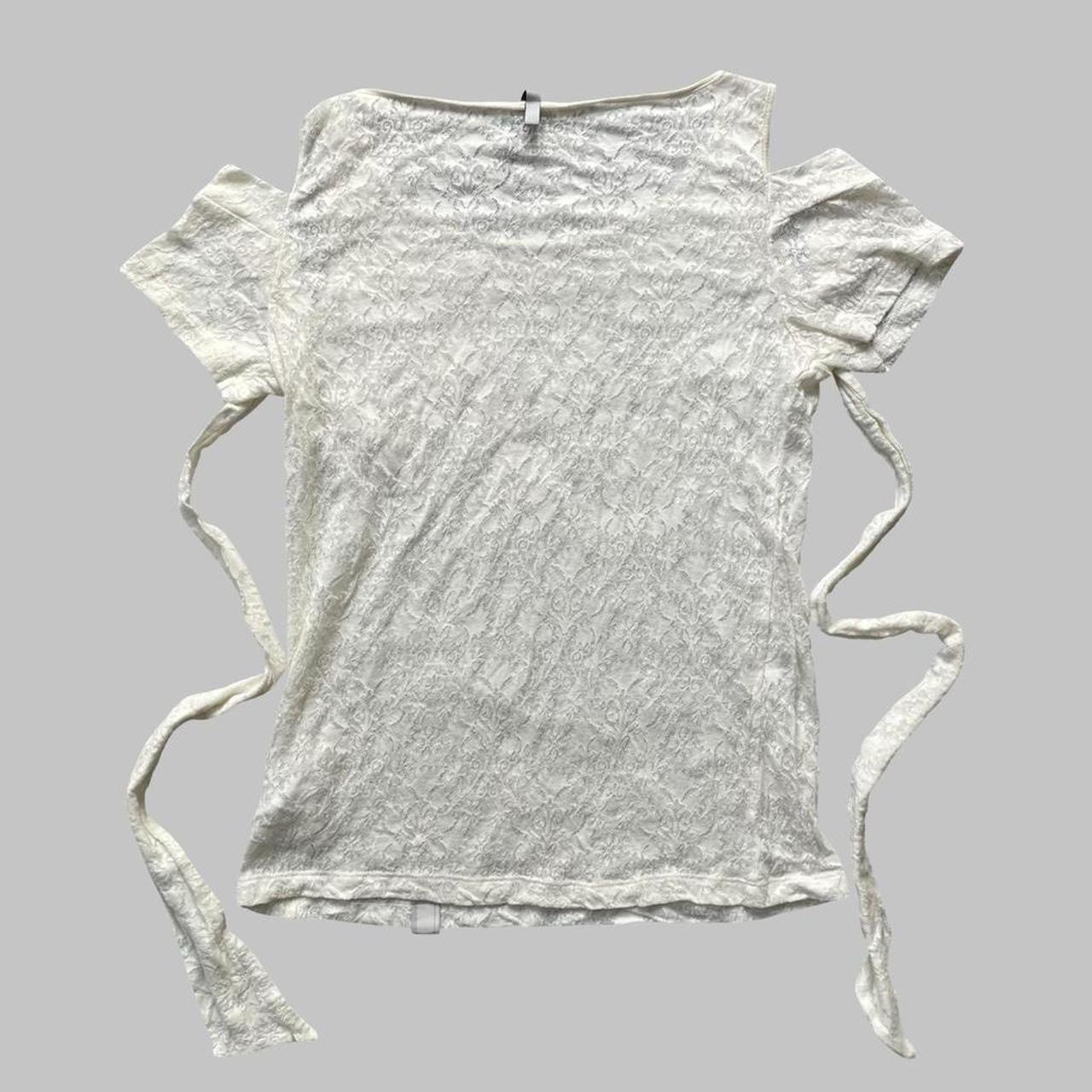 Cop Copine off-white lace cut-out top.
