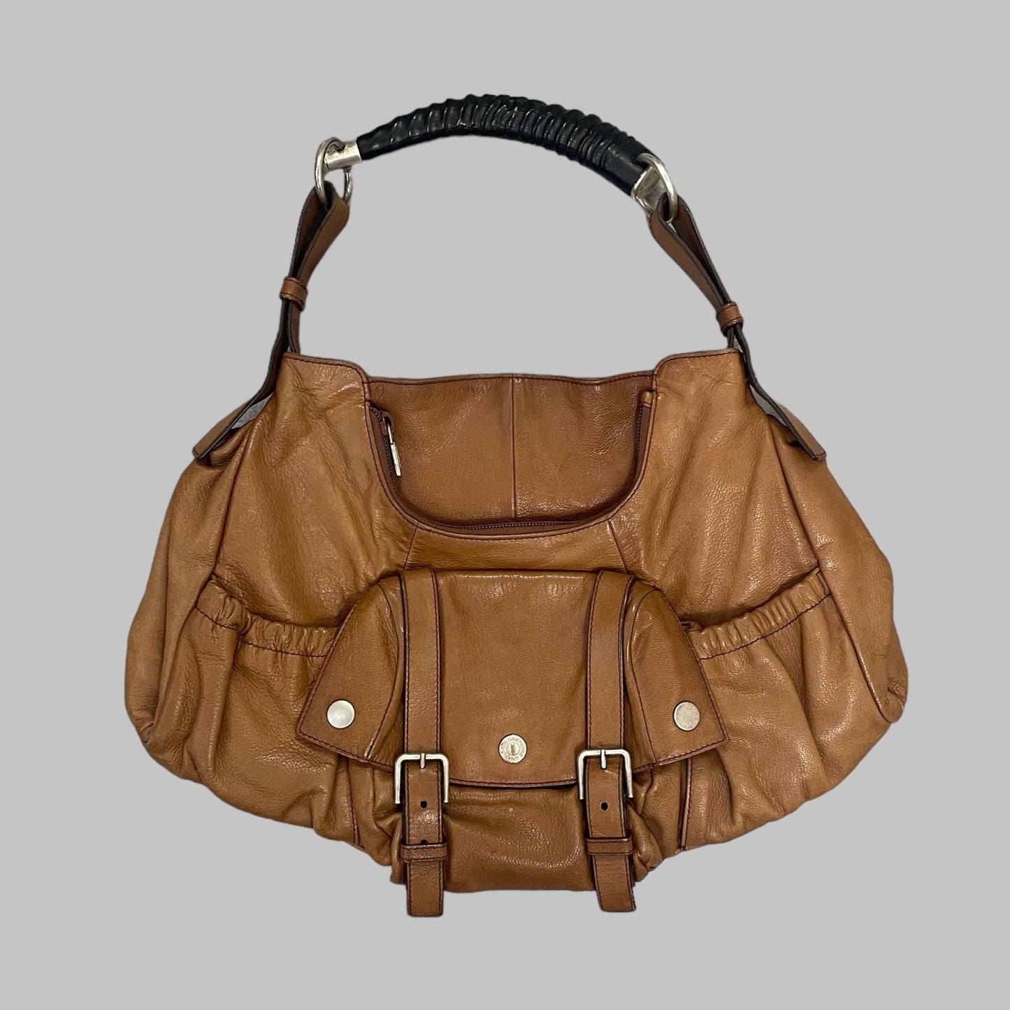 Yves Saint Laurent cognac leather bag.