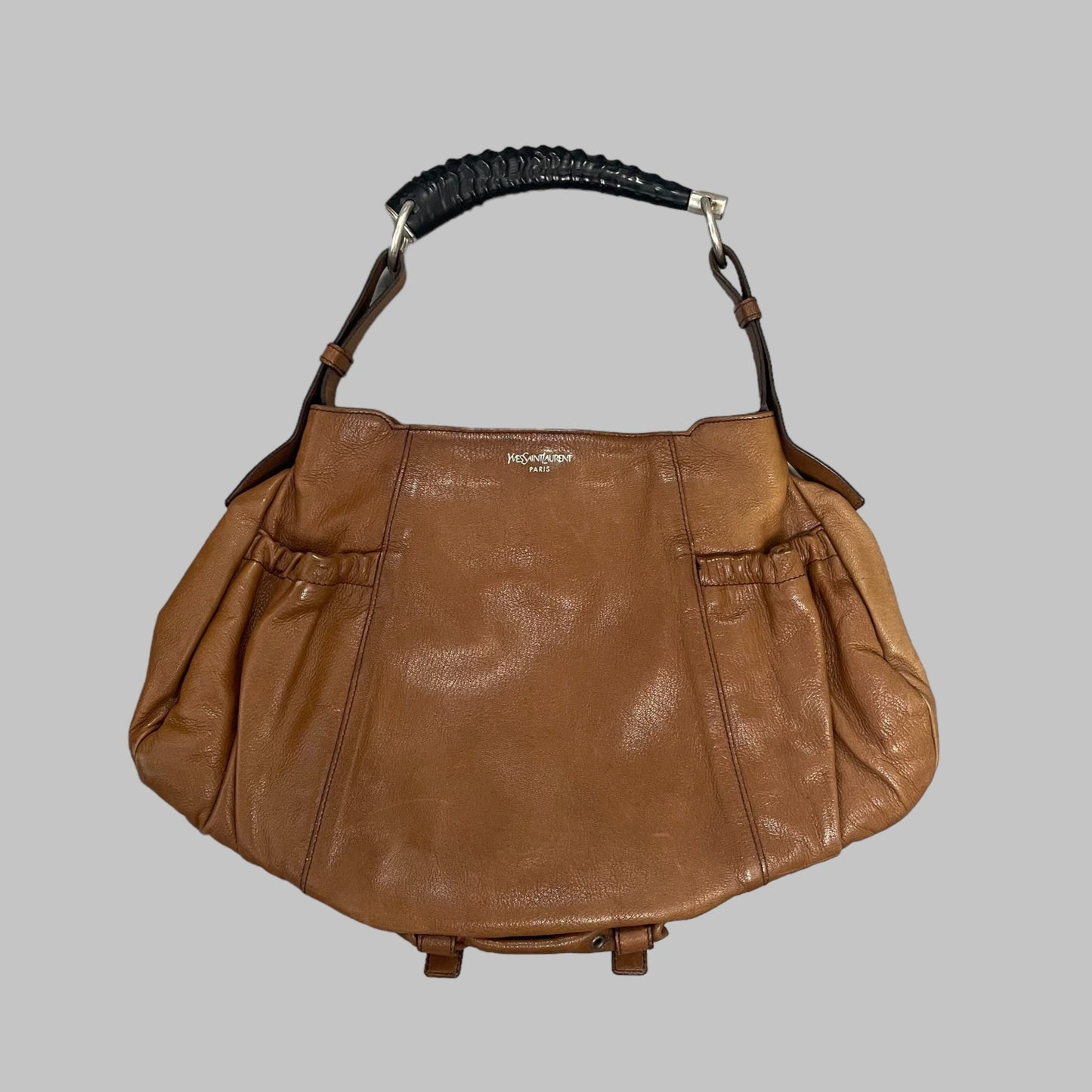 Yves Saint Laurent cognac leather bag.