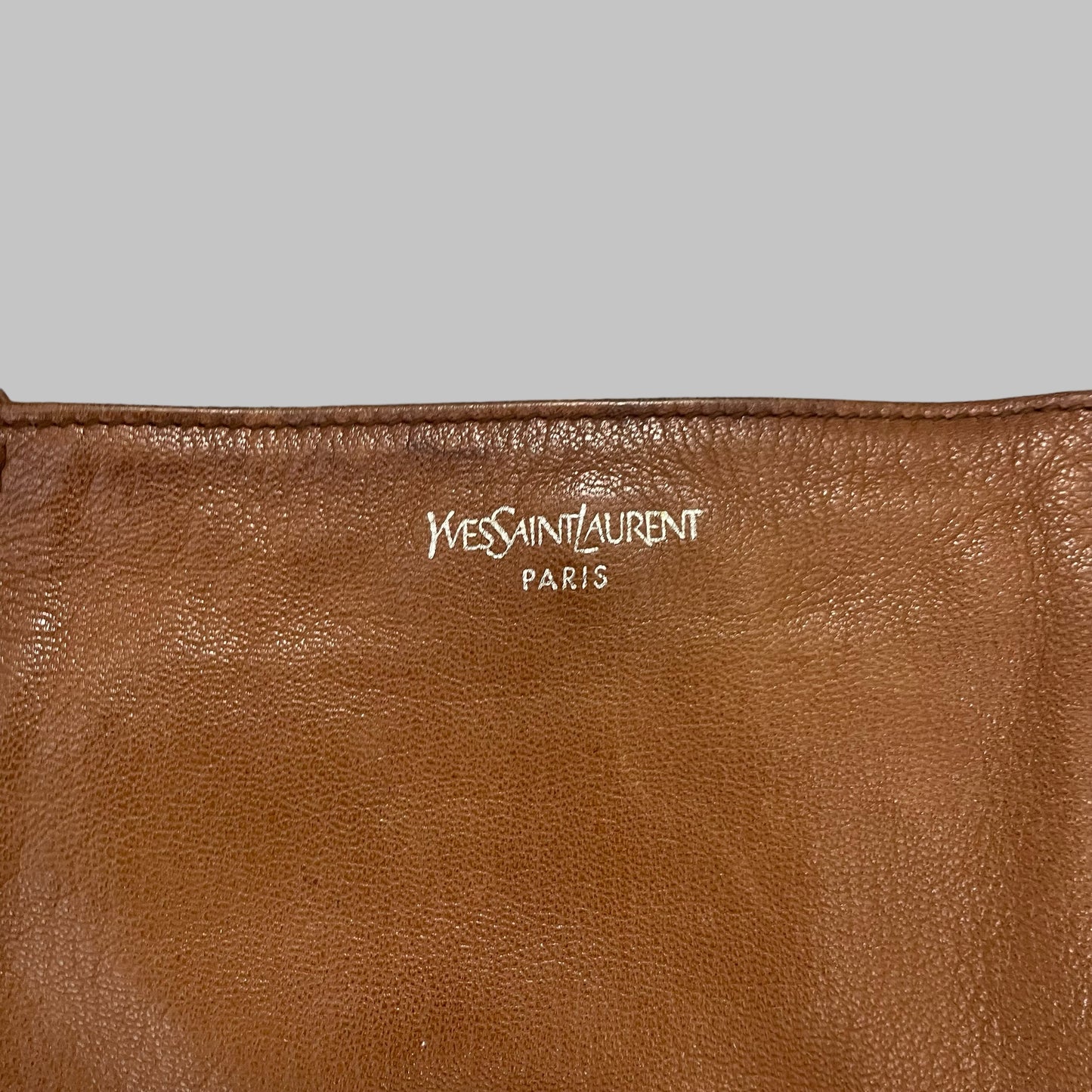 Yves Saint Laurent cognac leather bag.
