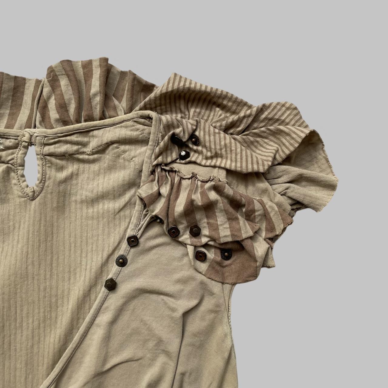 Beige and taupe striped top with studs.