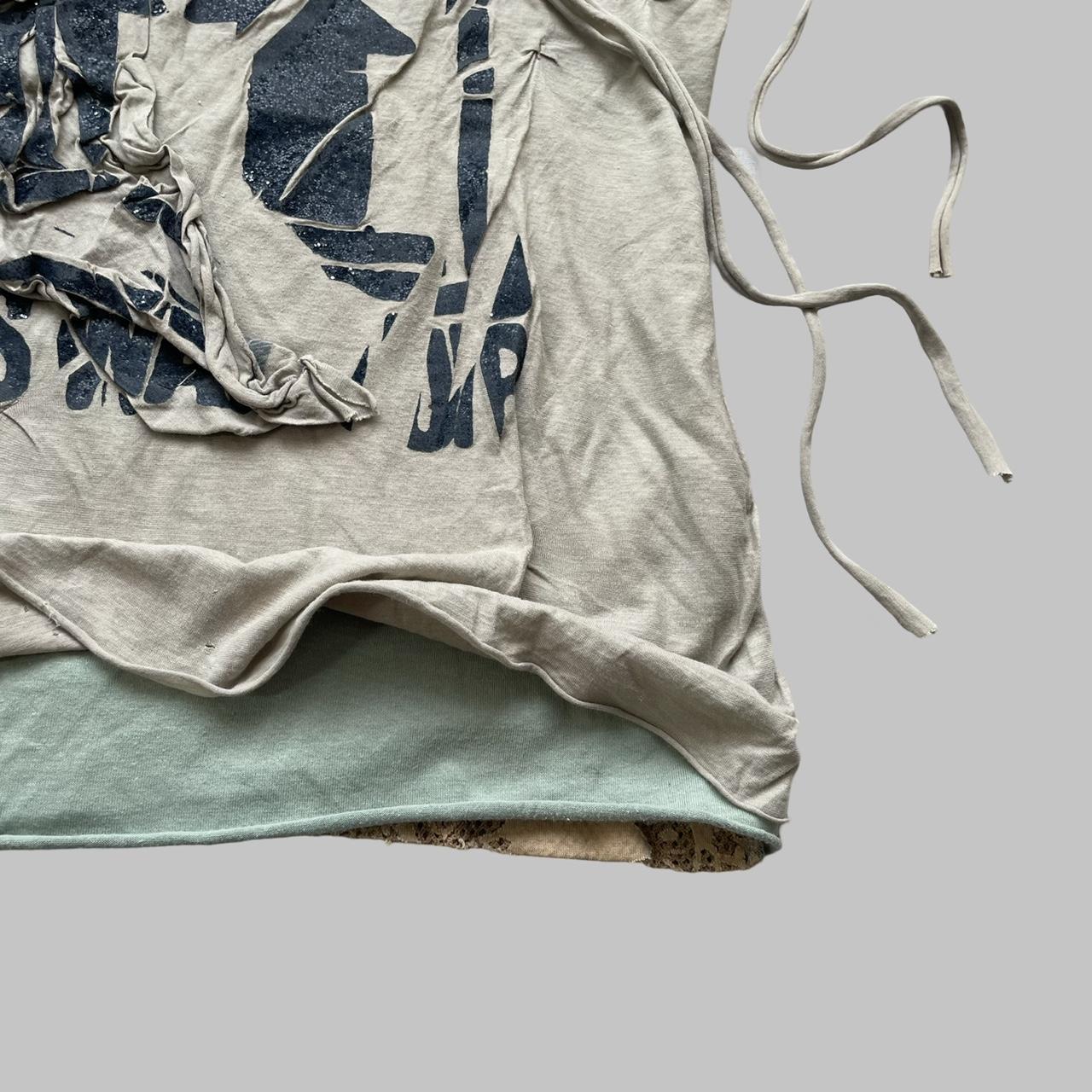 Beige double layered distressed tank top.
