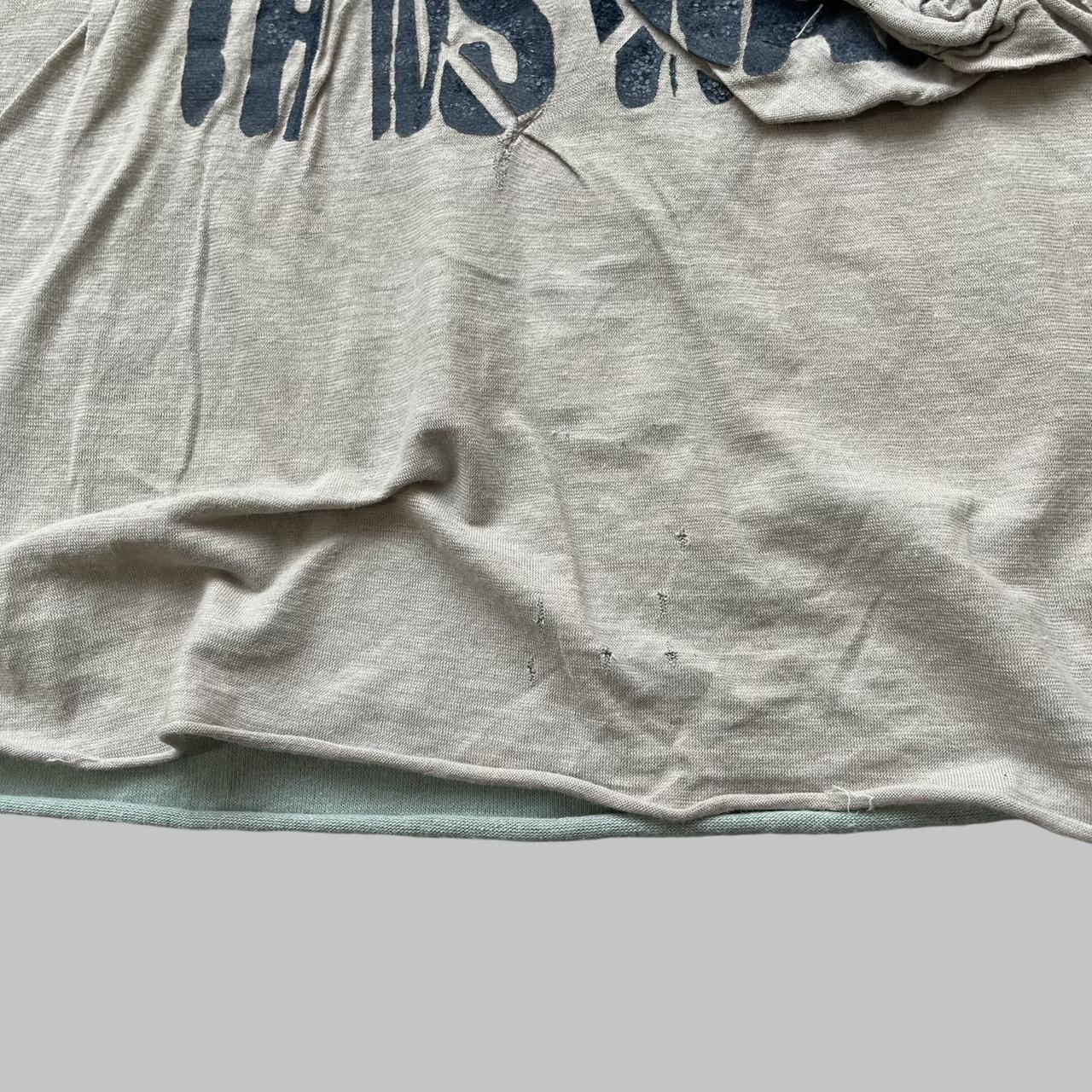 Beige double layered distressed tank top.