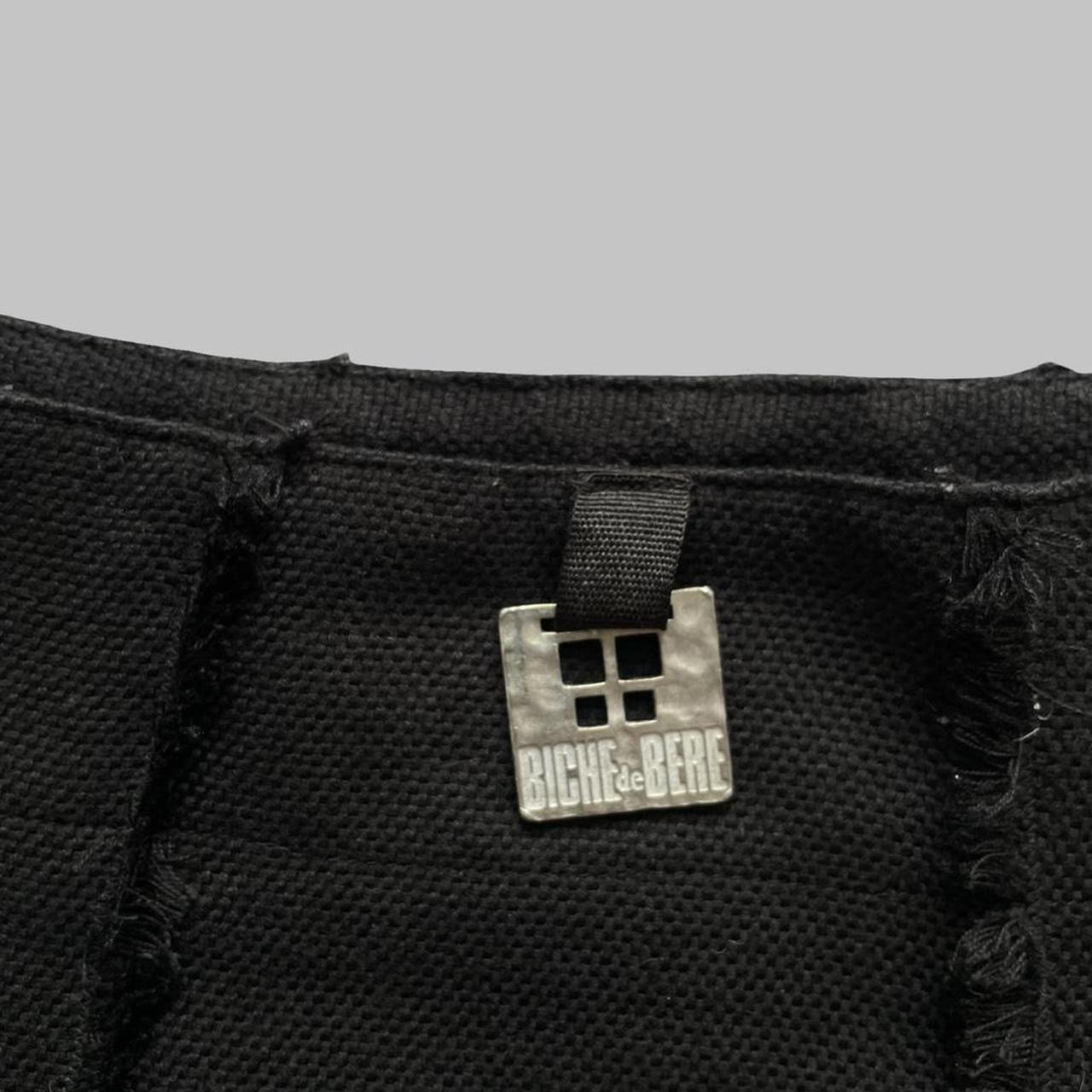 Black Biche de Bère black asymmetrical mini skirt.