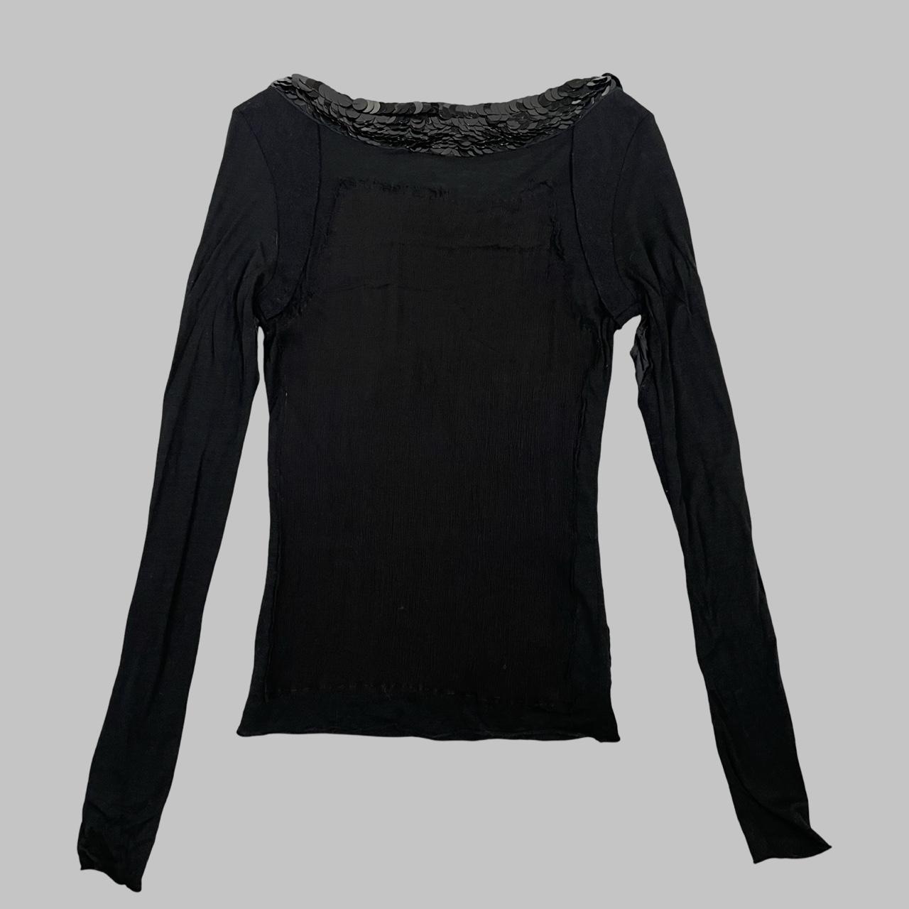 Multi-fabric patchwork black top with sequins.