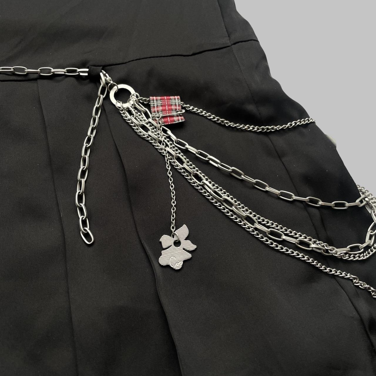 Cop copine black pleated mini skirt with silver chain belt.