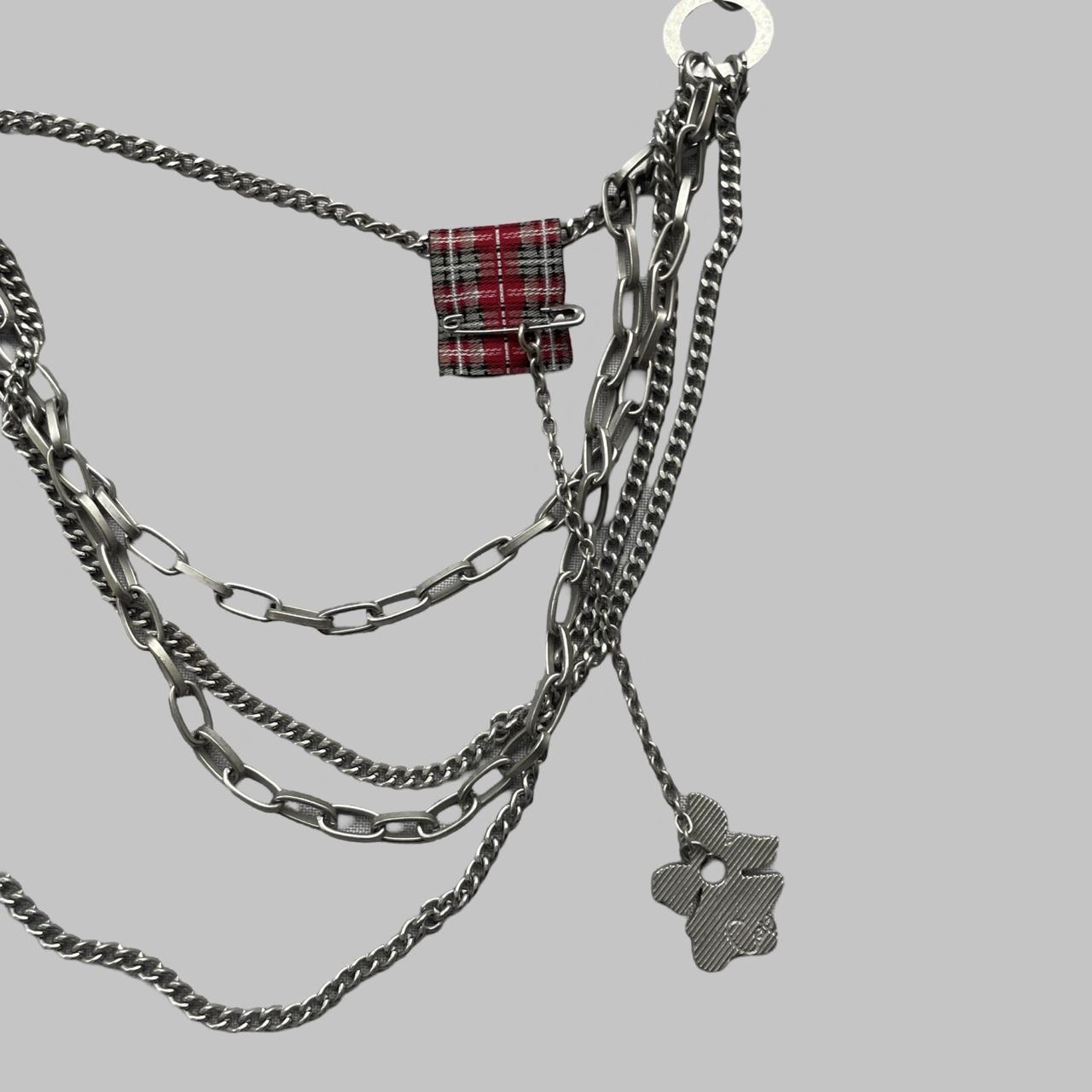 Cop copine black pleated mini skirt with silver chain belt.