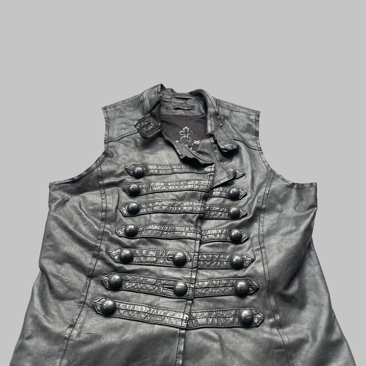 Sleeveless black leather officer jacket.