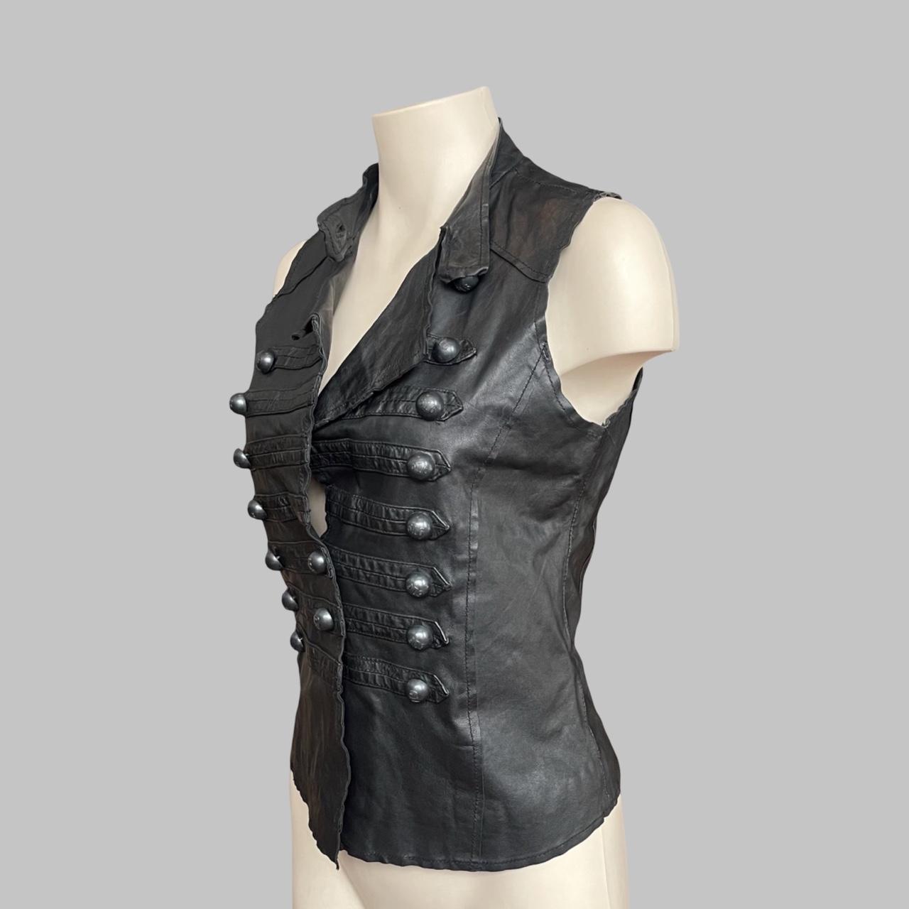 Sleeveless black leather officer jacket.