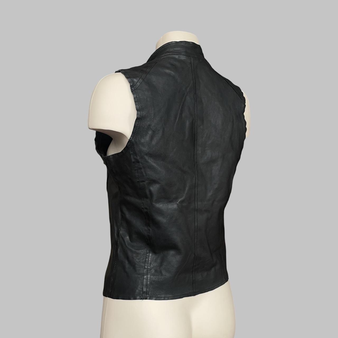 Sleeveless black leather officer jacket.