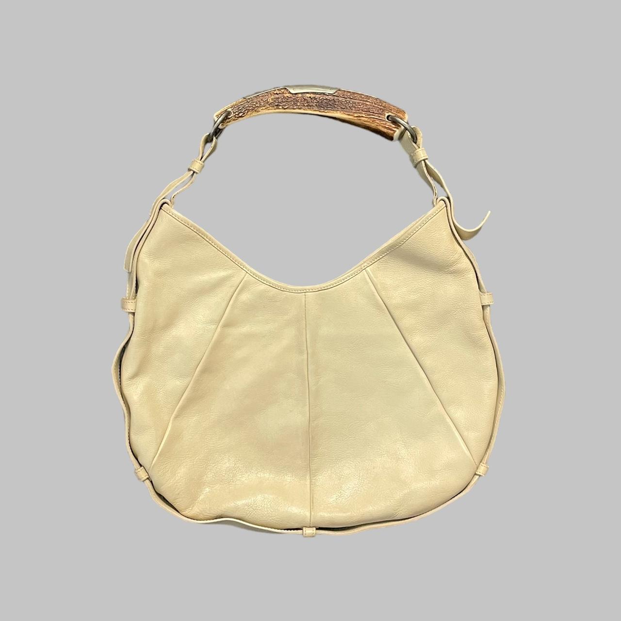 Yves Saint Laurent cream leather bag.