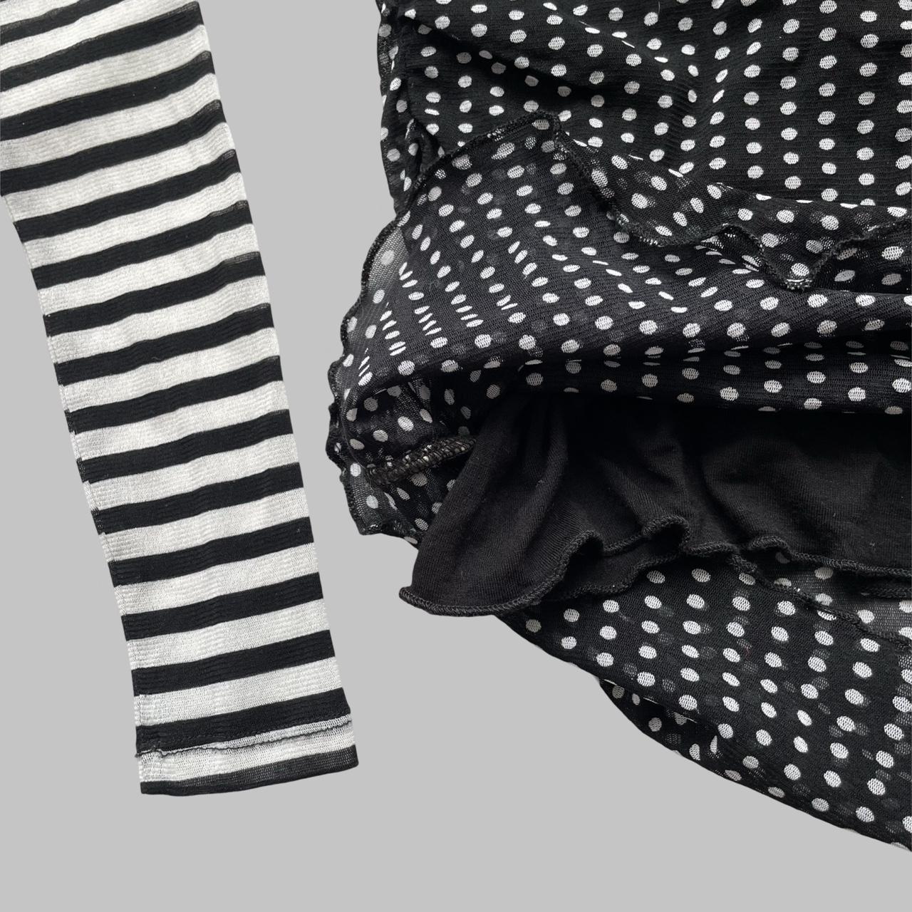 Black & white polkadots and stripes shirt.