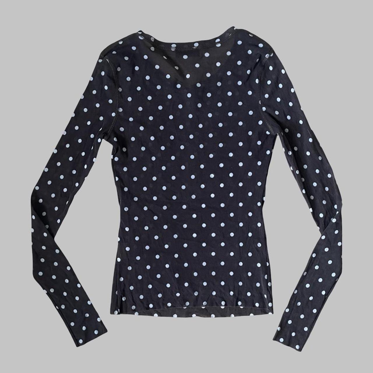 Brown polka dot mesh top.