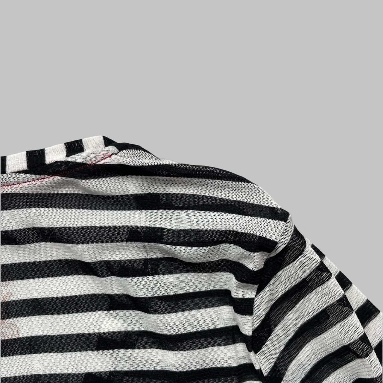 Black & white polkadots and stripes shirt.