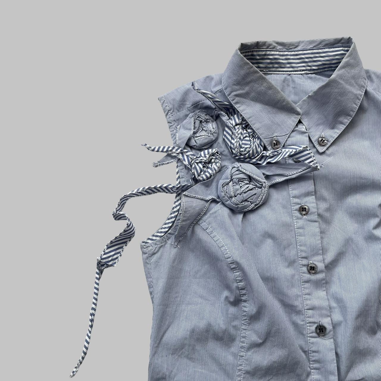 Blue striped textured sleeveless shirt.