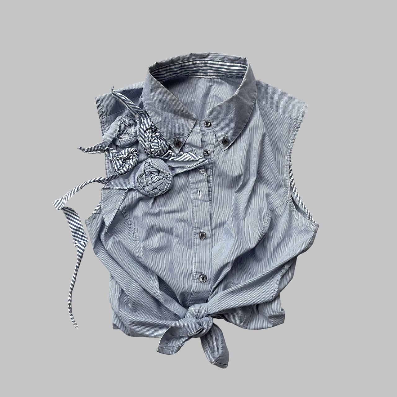 Blue striped textured sleeveless shirt.