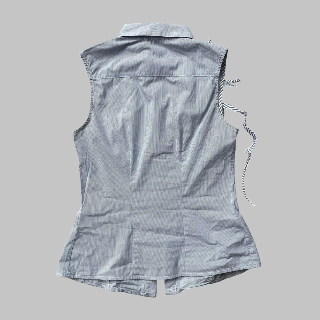 Blue striped textured sleeveless shirt.