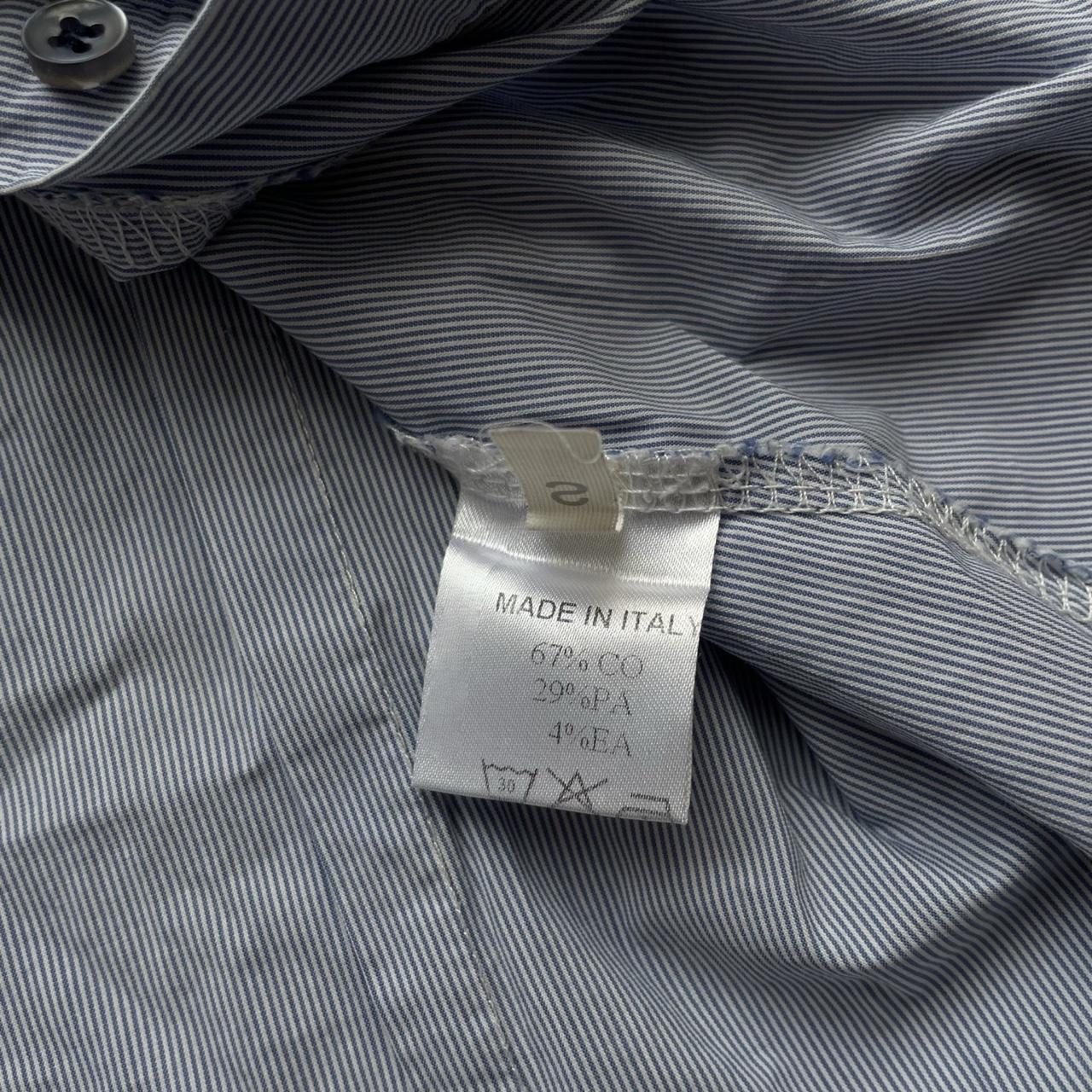 Blue striped textured sleeveless shirt.