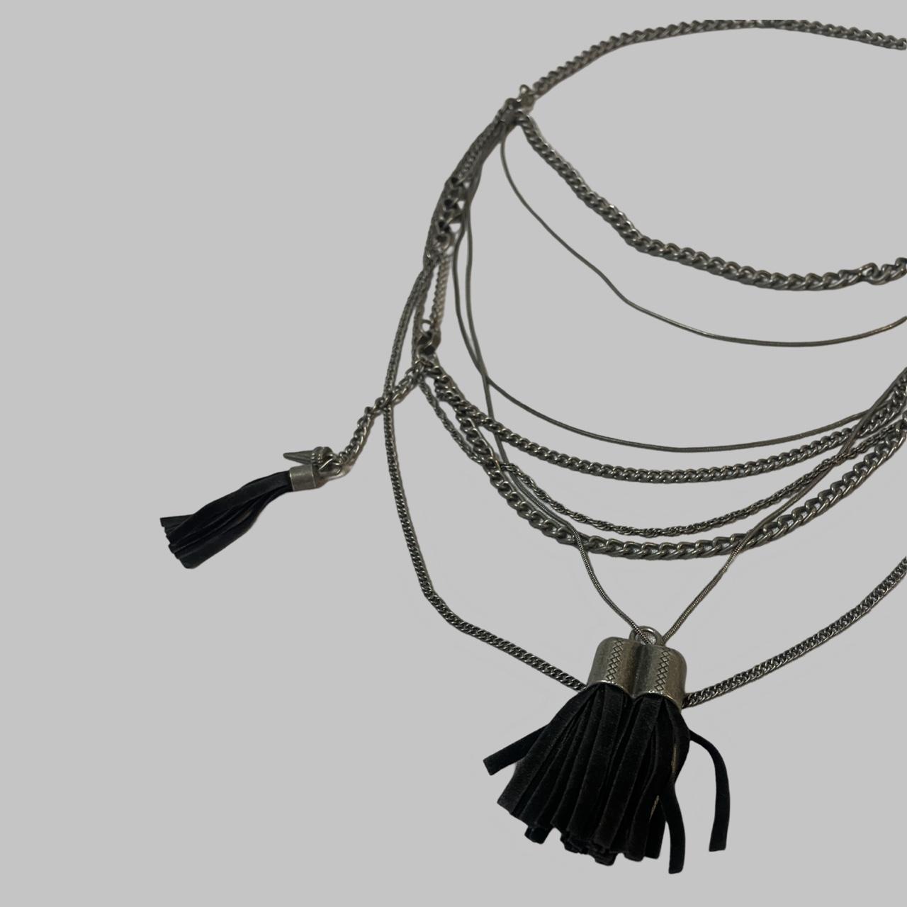 Sautoir silver and suede necklace.