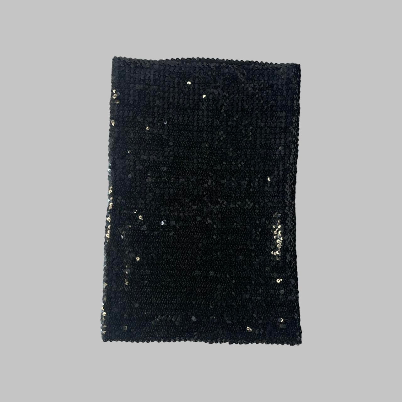 Two-way black sequin skirt / top.