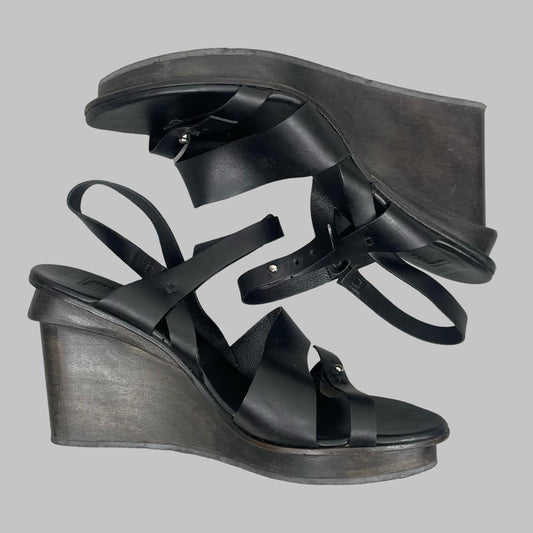 Marithé + François Girbaud black leather wooden wedge sandals.
