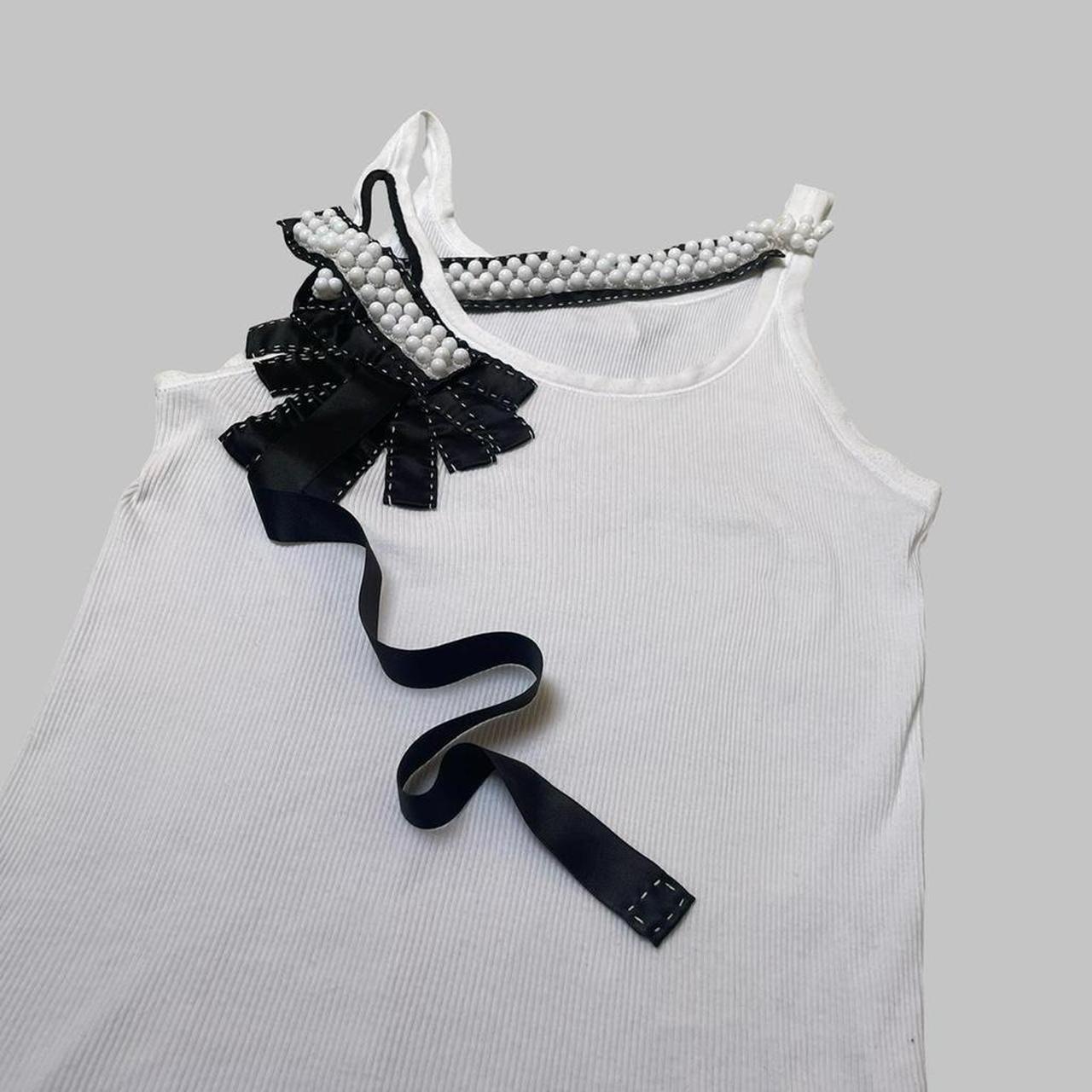 Italian white tank top with ribbons and pearls.