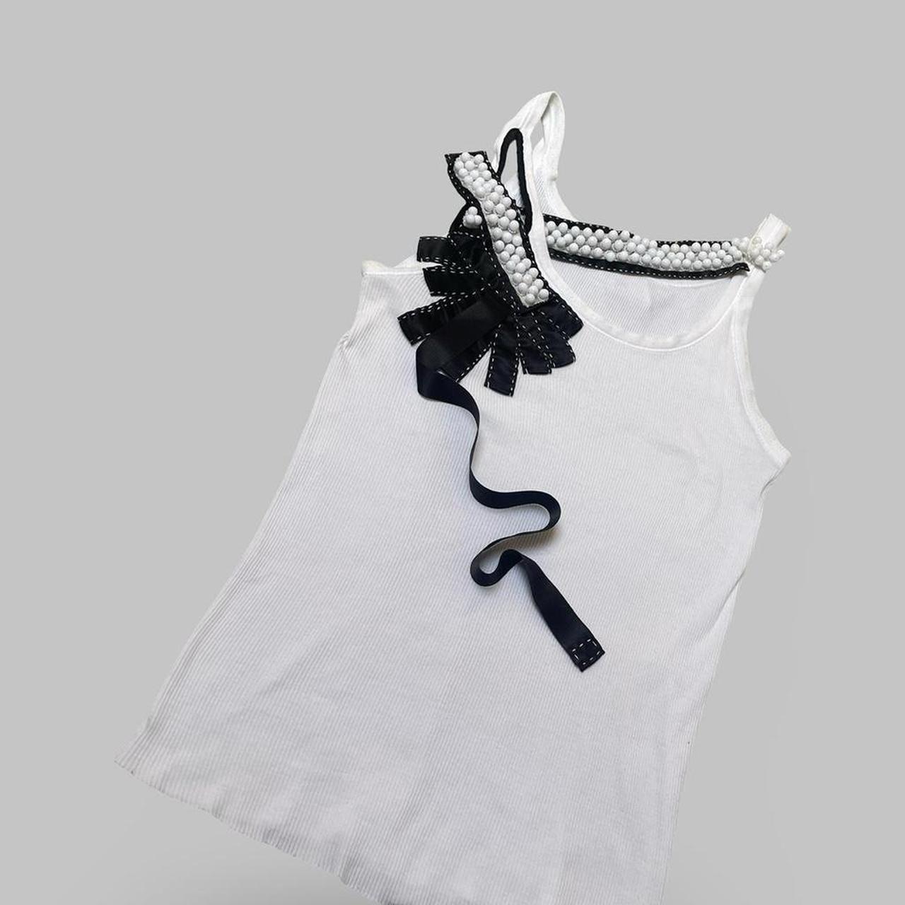 Italian white tank top with ribbons and pearls.