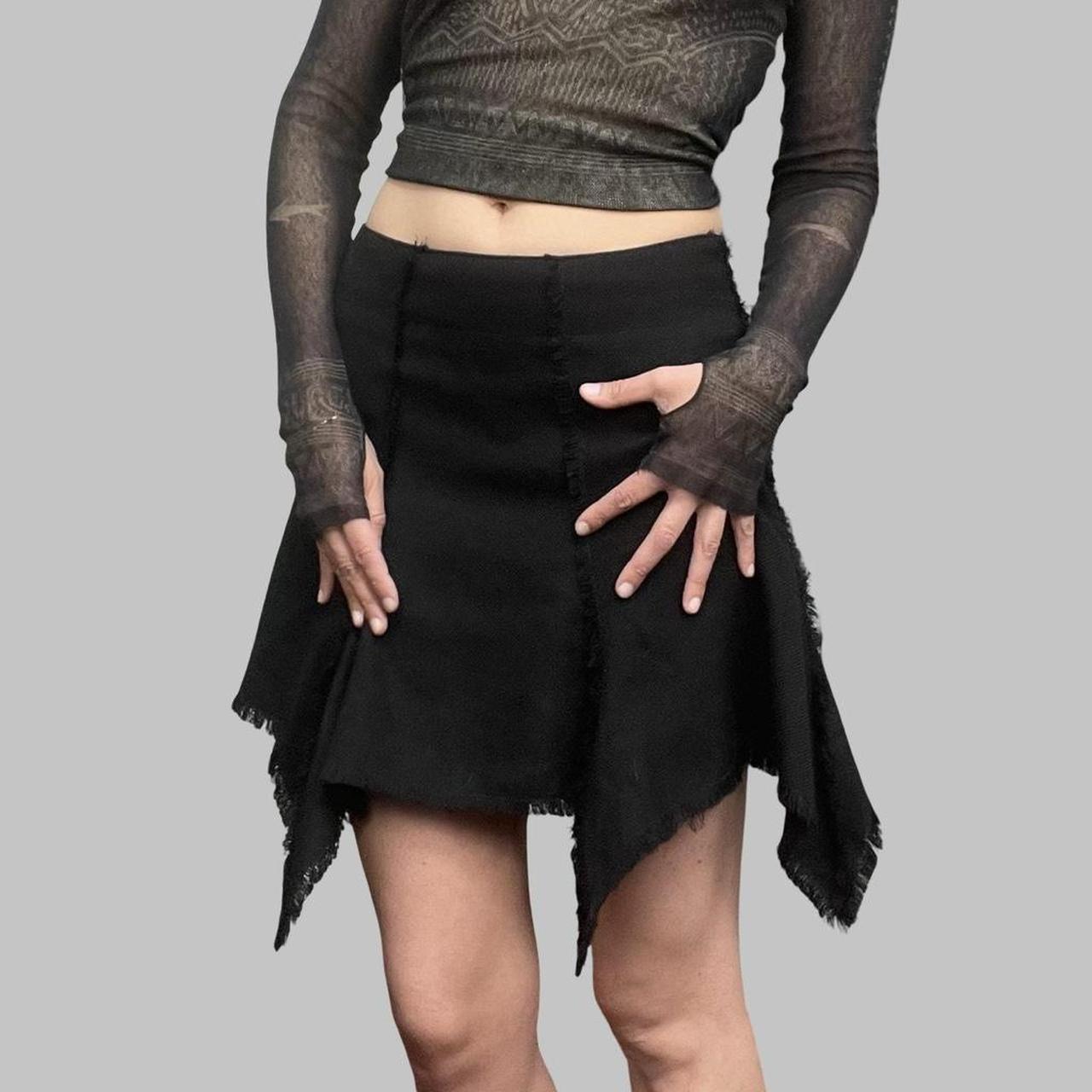 Black Biche de Bère black asymmetrical mini skirt.