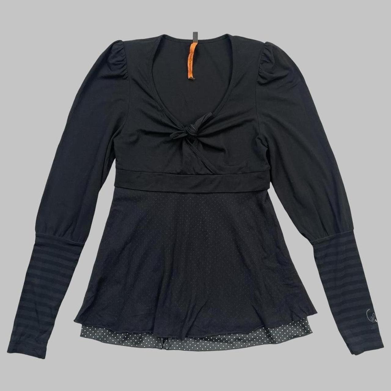 Cop copine black top with striped sleeves.