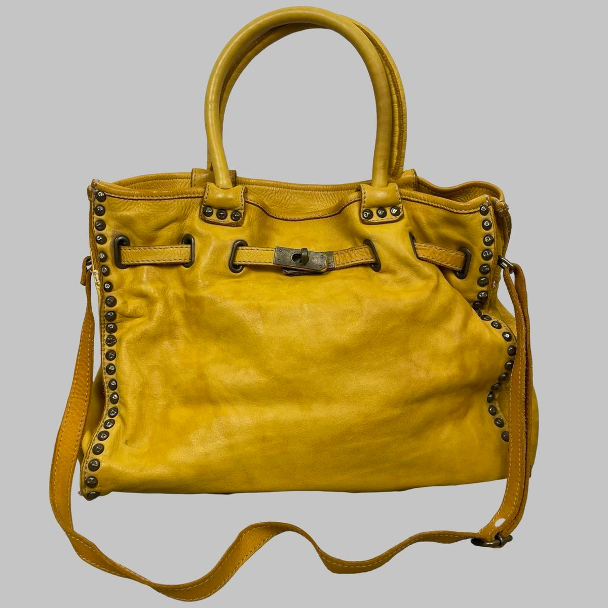 Large yellow leather studded firkin bag. — photo 1