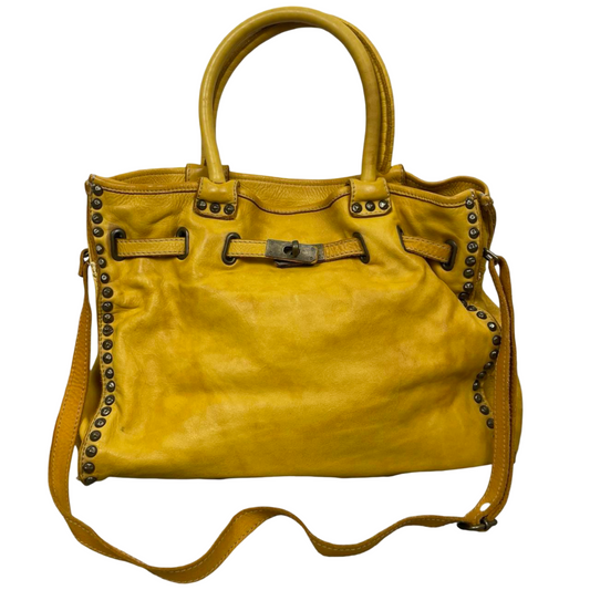 06 - Large yellow leather studded firkin bag.