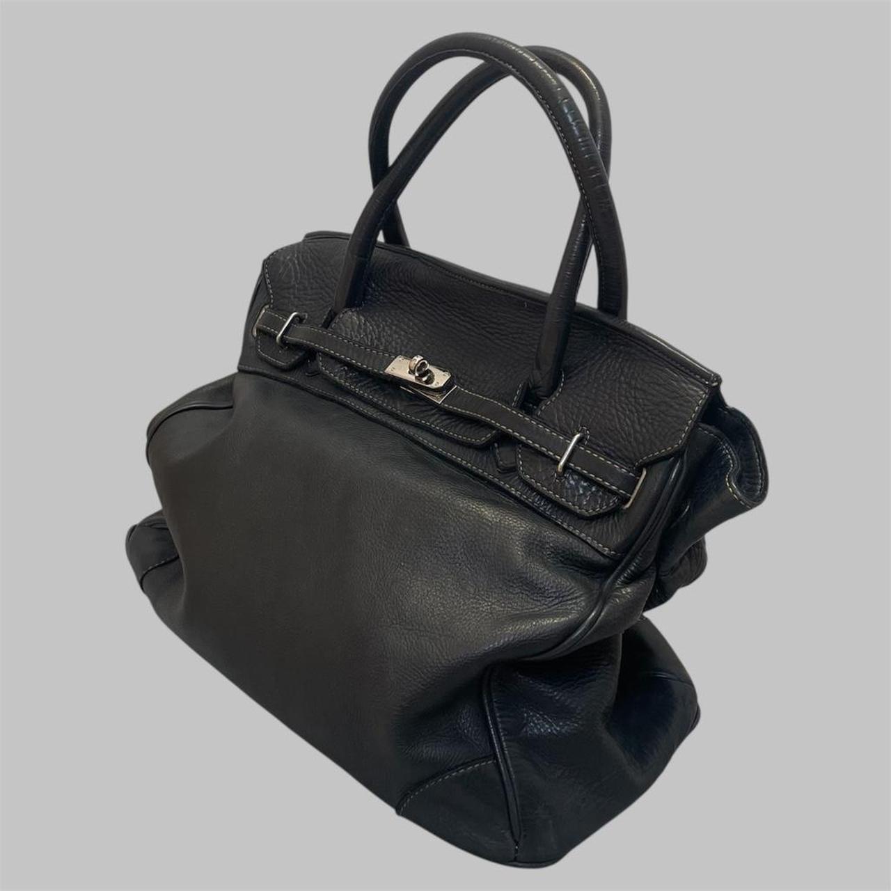 Black (large) leather firkin bag.