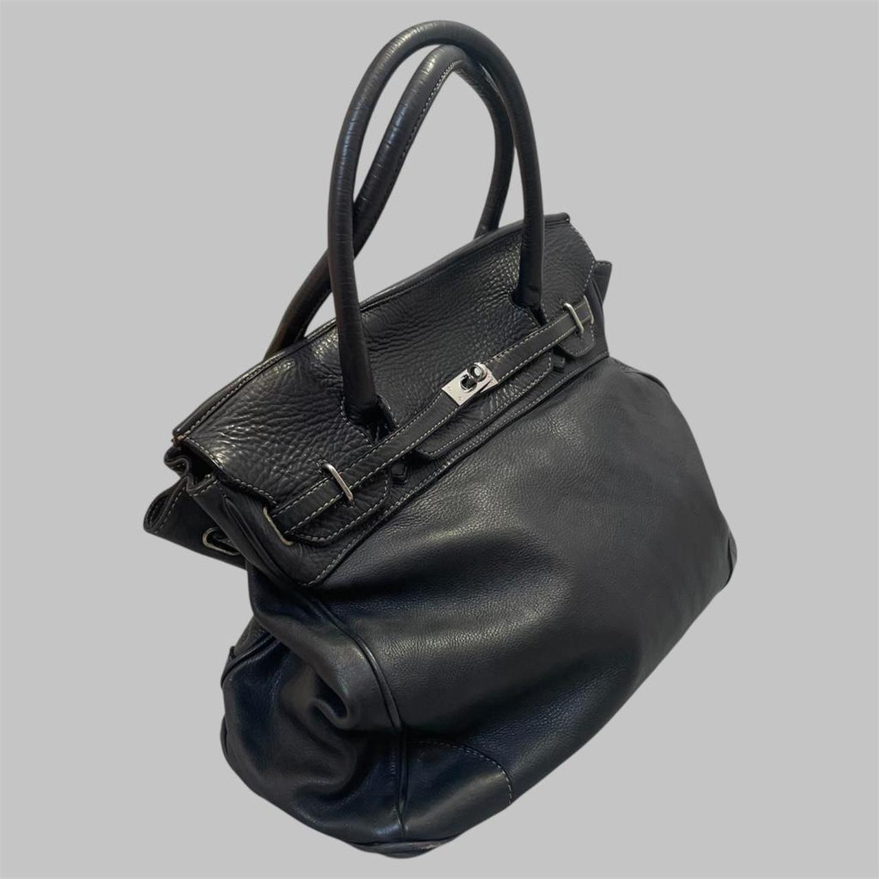 Black (large) leather firkin bag.