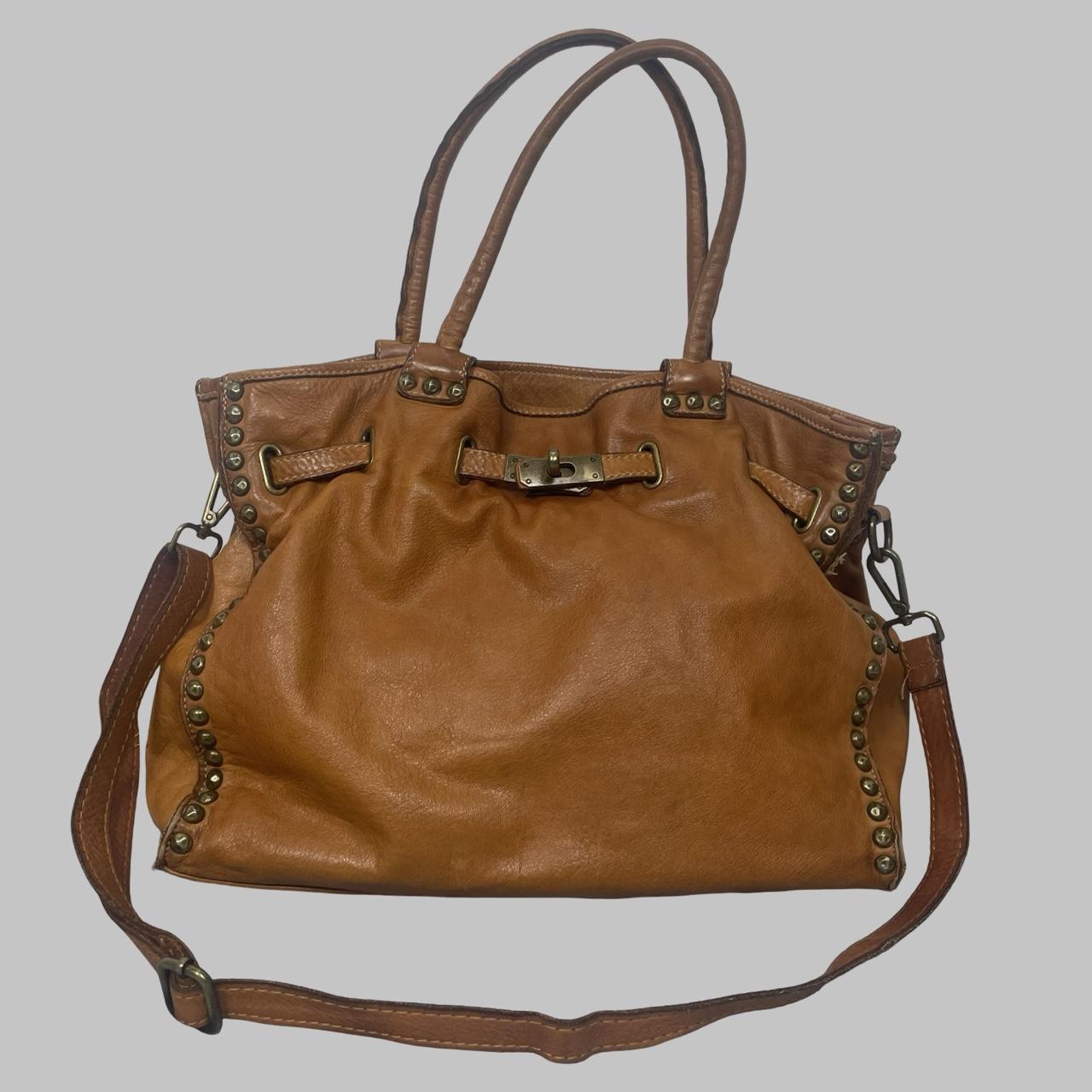 01 - Large cognac leather studded firkin bag.
