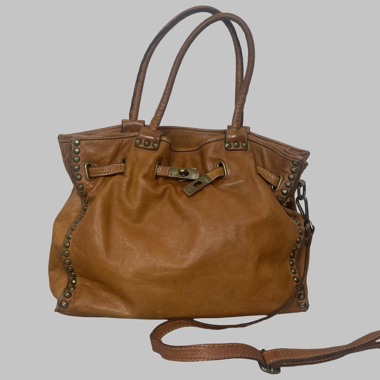 01 - Large cognac leather studded firkin bag.
