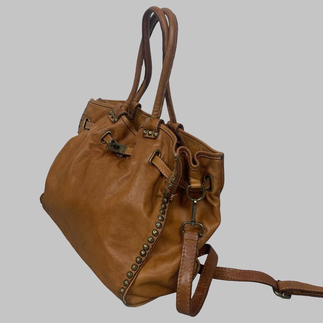 01 - Large cognac leather studded firkin bag.