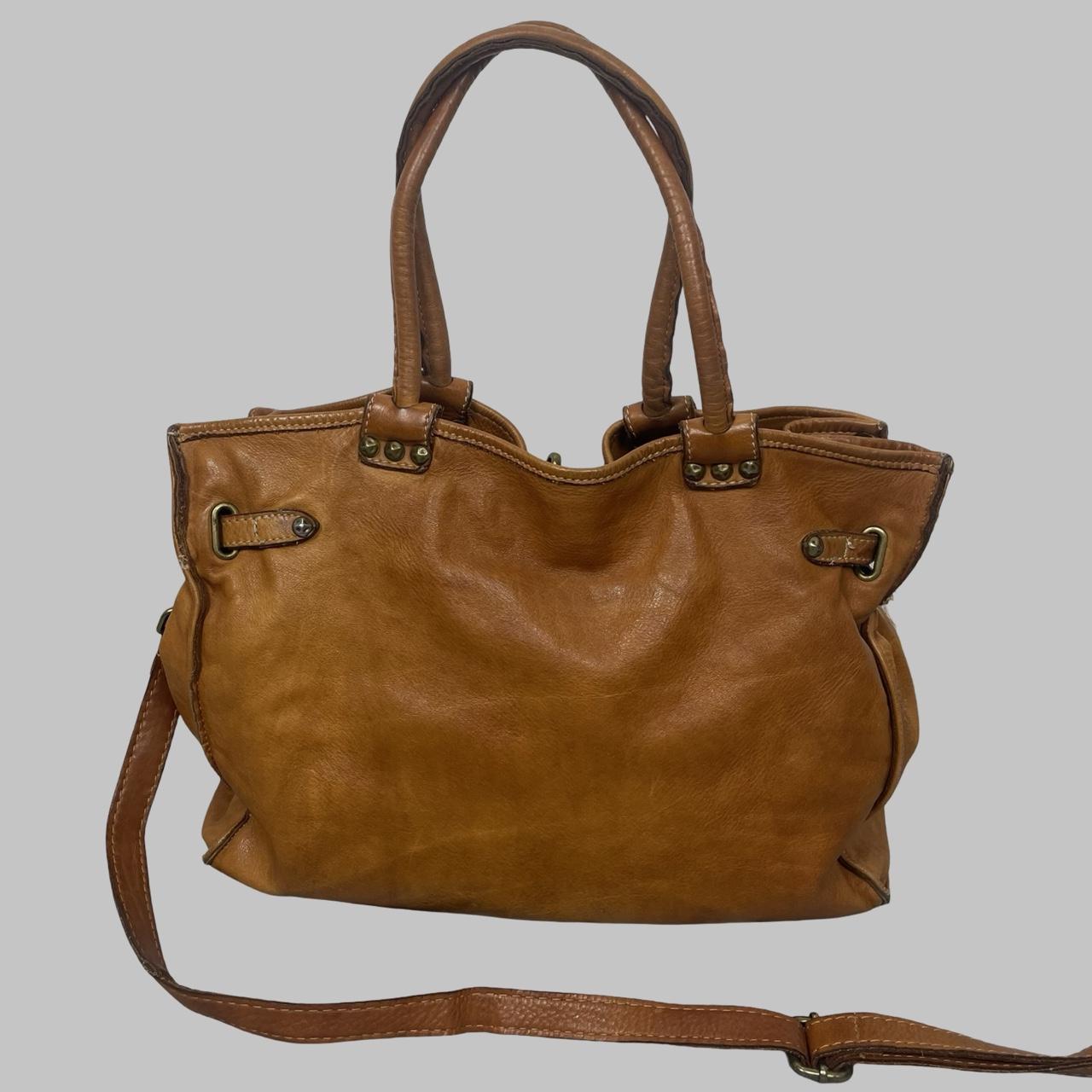 01 - Large cognac leather studded firkin bag.
