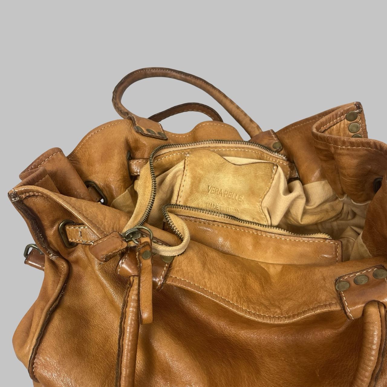 01 - Large cognac leather studded firkin bag.