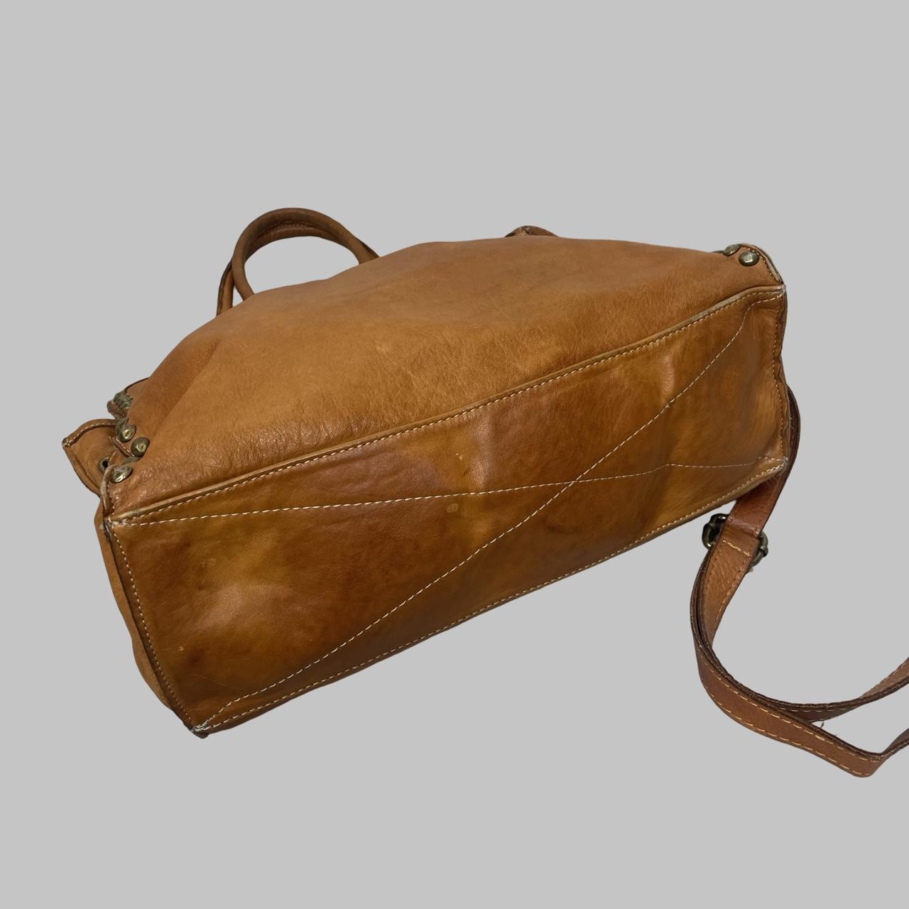 01 - Large cognac leather studded firkin bag.
