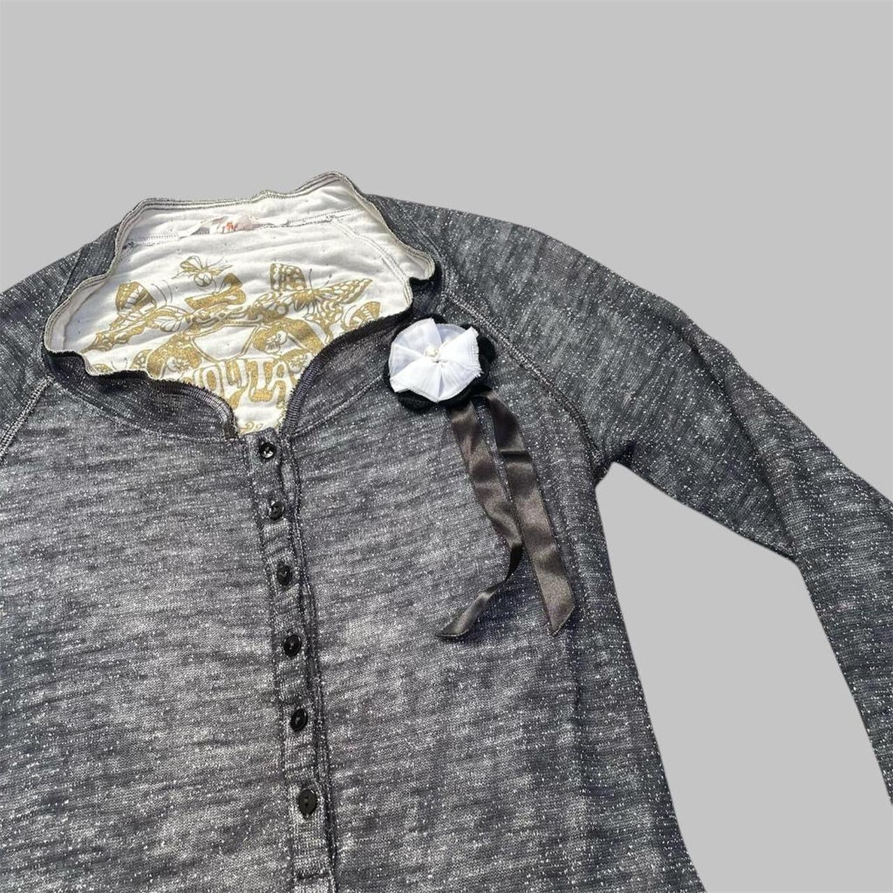 Italian knit top with removable brooch.