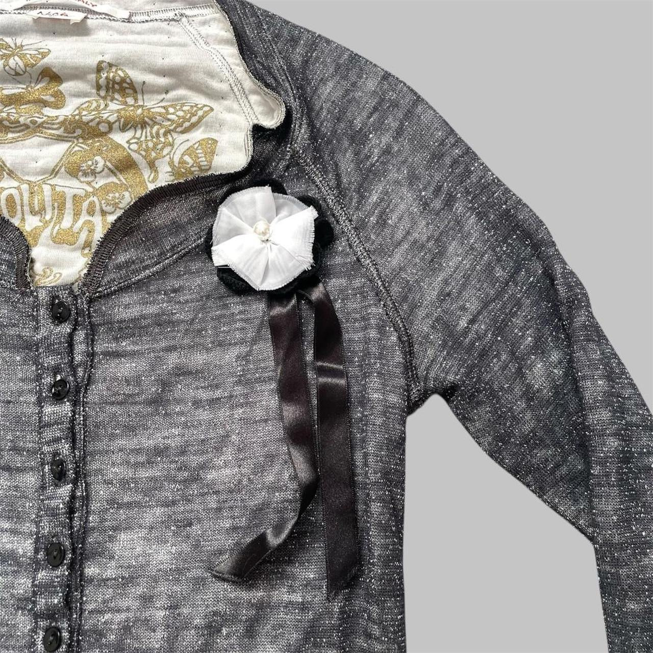 Italian knit top with removable brooch.