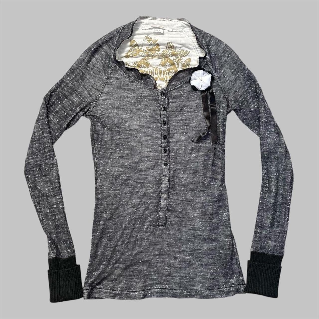 Italian knit top with removable brooch.