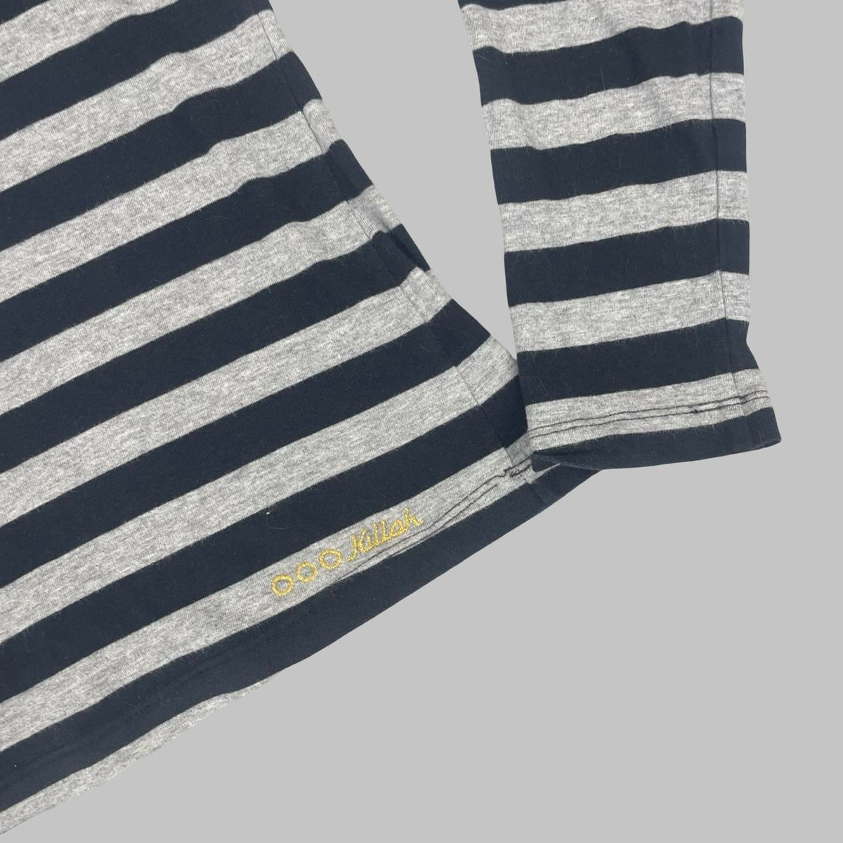 Killah black and grey striped long sleeve top.