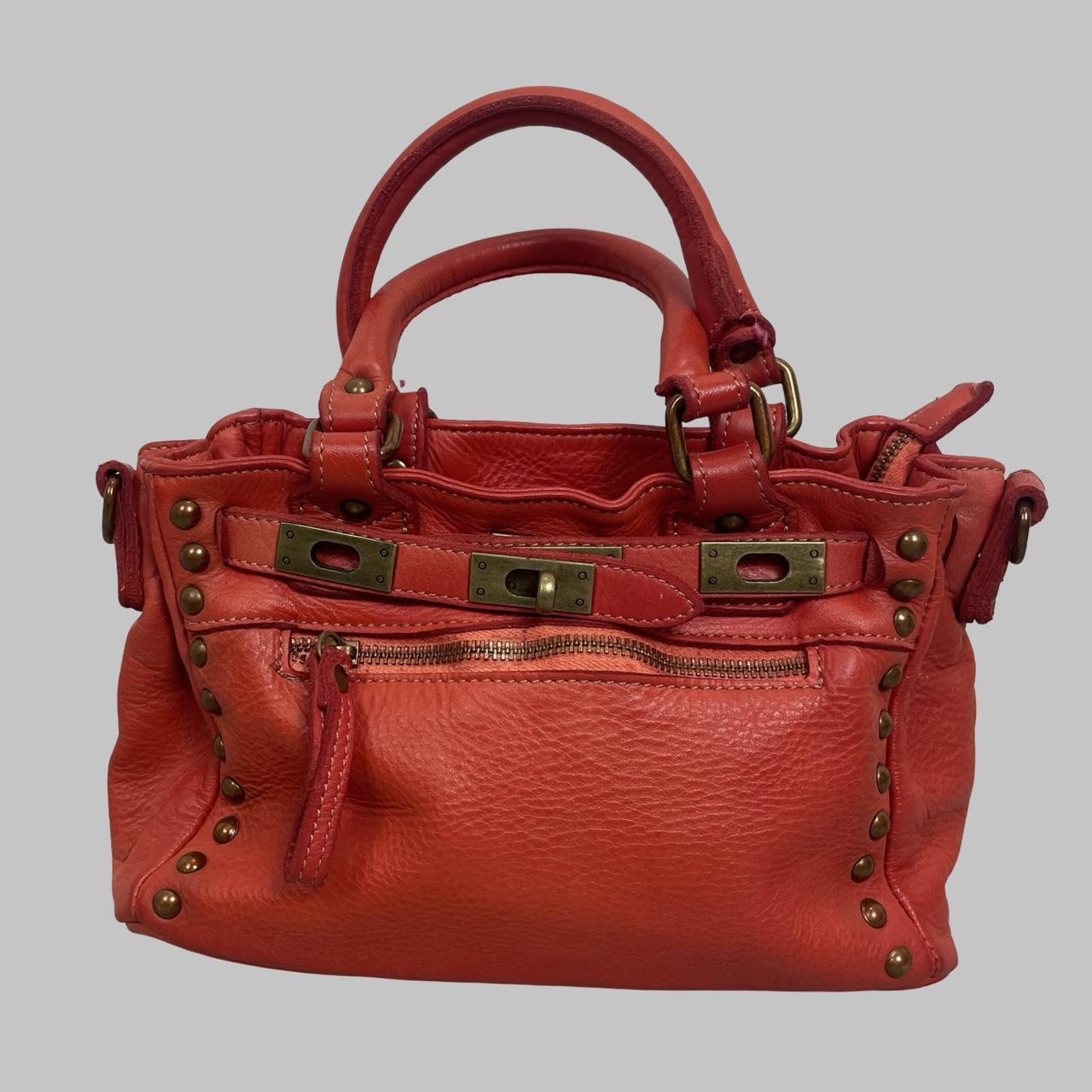 03 - Small red leather firkin bag with studs.