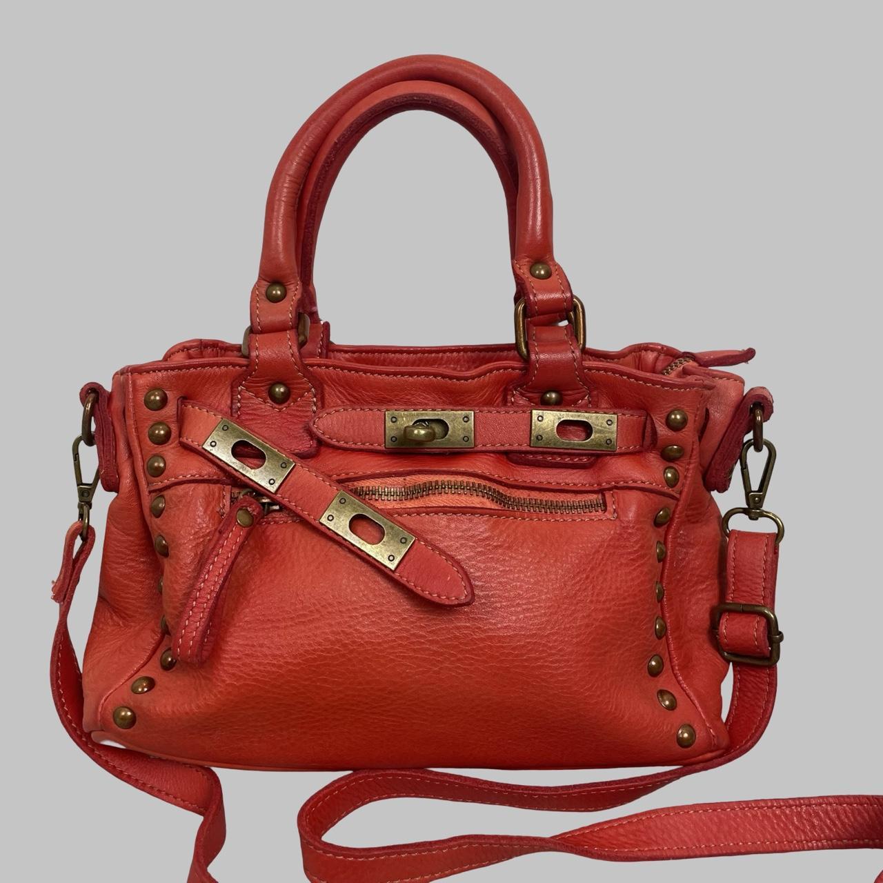 03 - Small red leather firkin bag with studs.